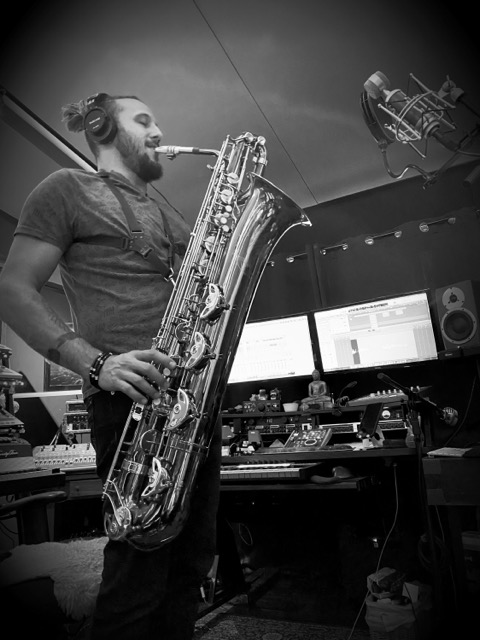 Toby playing baritone saxophone